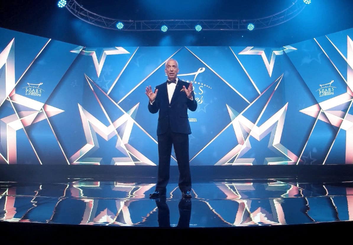 Stunning stage setup for a live event at TriVision Studios with dynamic lighting and digital backdrop showcasing a performance or presentation.