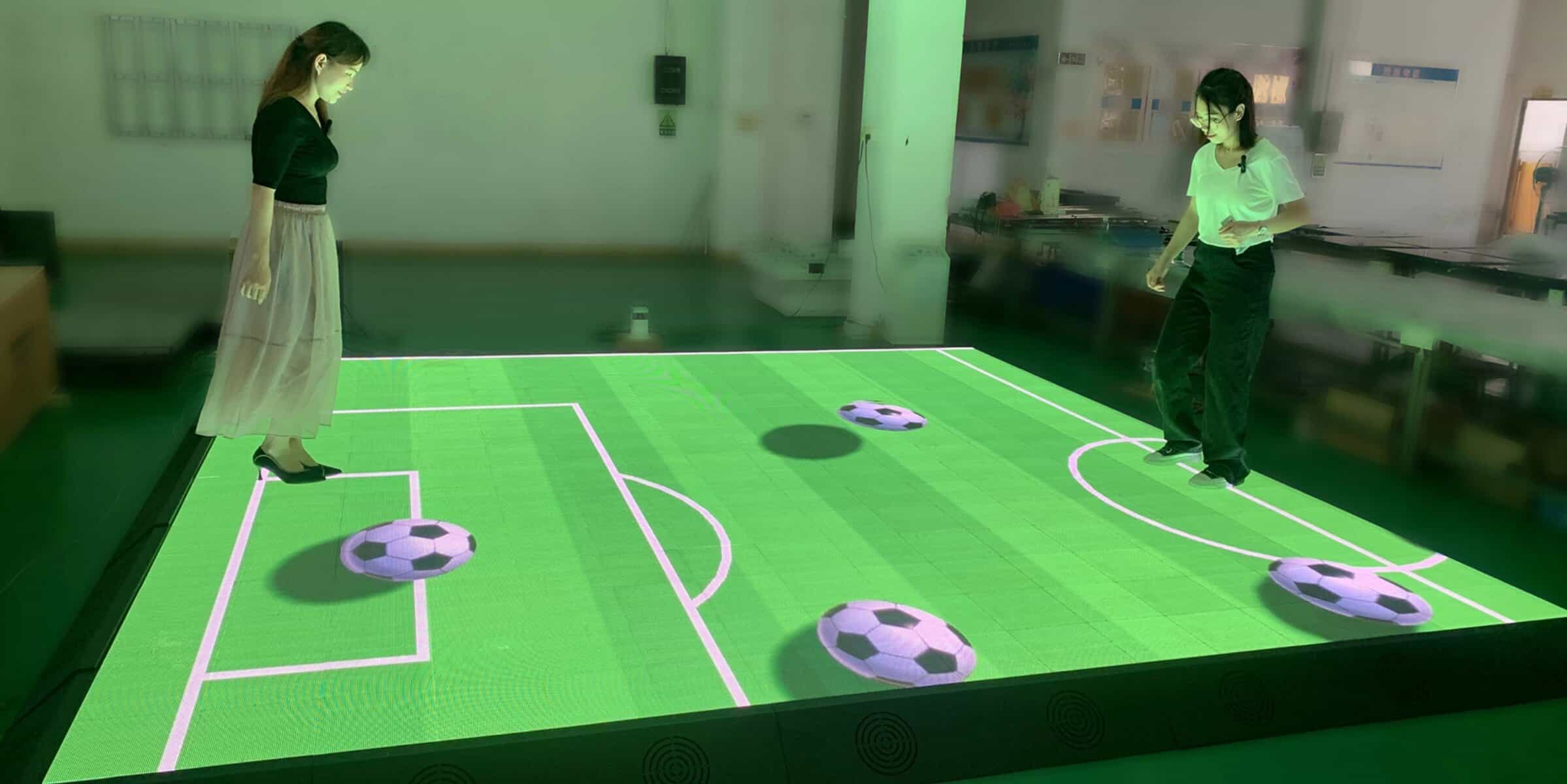 Interactive LED soccer table for entertainment and recreational activities at TriVision Studios, showcasing innovative digital gaming technology.