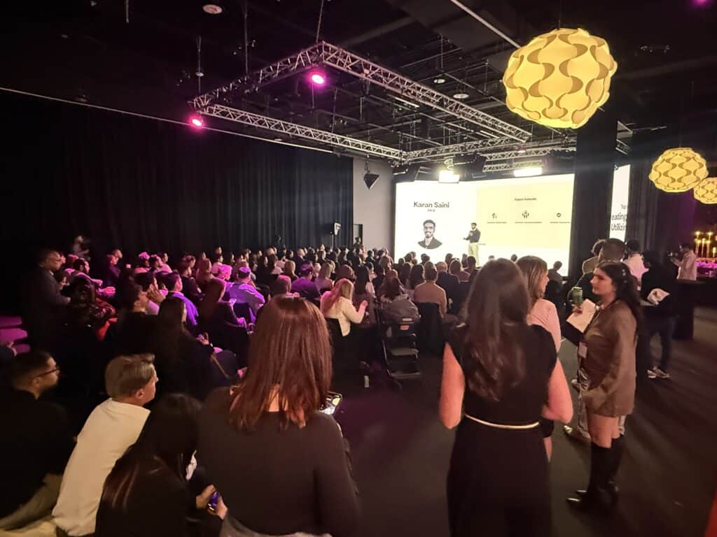 Innovative AV solutions at TriVision Studios, professional event production, dynamic stage lighting, corporate conference setup, large audience engagement, high-quality video presentation, modern event technology, event planning and execution, T V conference staging, indoor corporate event image. Live Event Production DMV