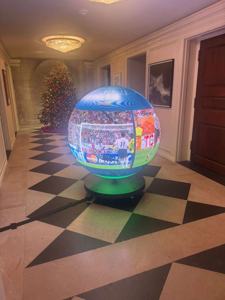 High-resolution 3D LED sphere showcasing real-time soccer game in a luxurious indoor setting, highlighting immersive visual technology and event presentation expertise at TriVision Studios.