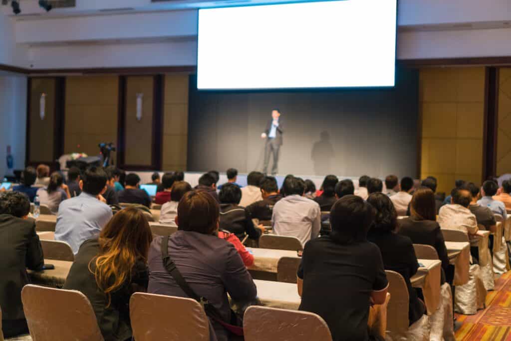 Reliable corporate video production services at TriVision Studios, featuring professional presenters and engaging conference visuals, perfect for business events and meetings.