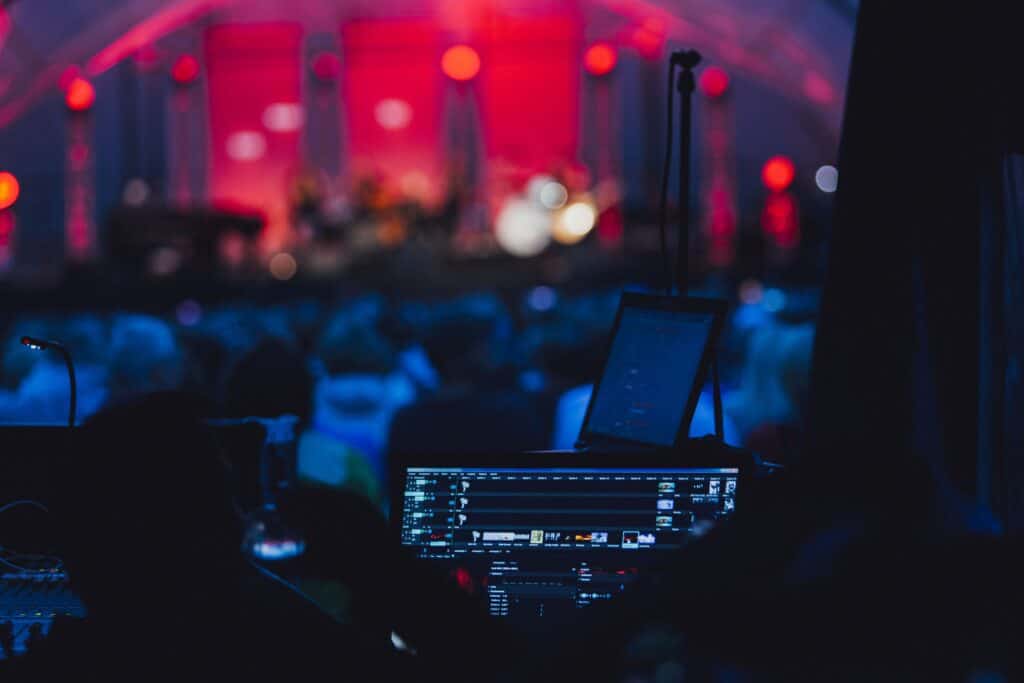 A photo of a live event setup highlighting TriVision Studios' event production services, featuring lighting, sound, and staging equipment used for concerts and performances.