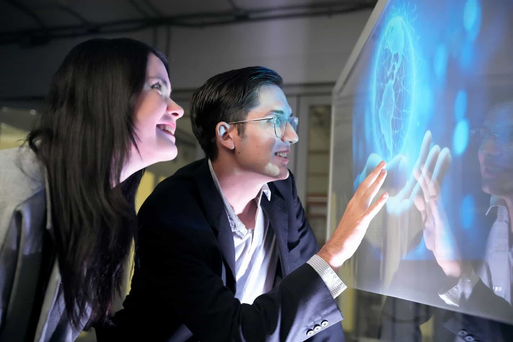 High-tech interaction with digital display and holographic interface at TriVision Studios.