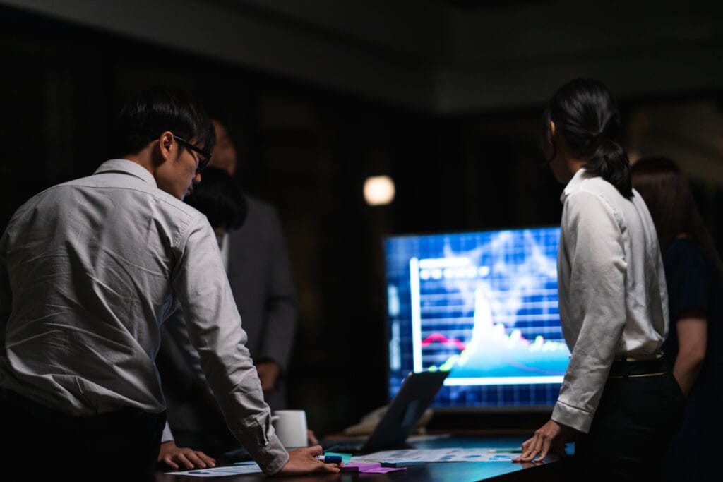 millennial asia businessmen and businesswomen meet 2026 01 05 23 26 19 utc People analyzing digital marketing data in a professional studio environment.